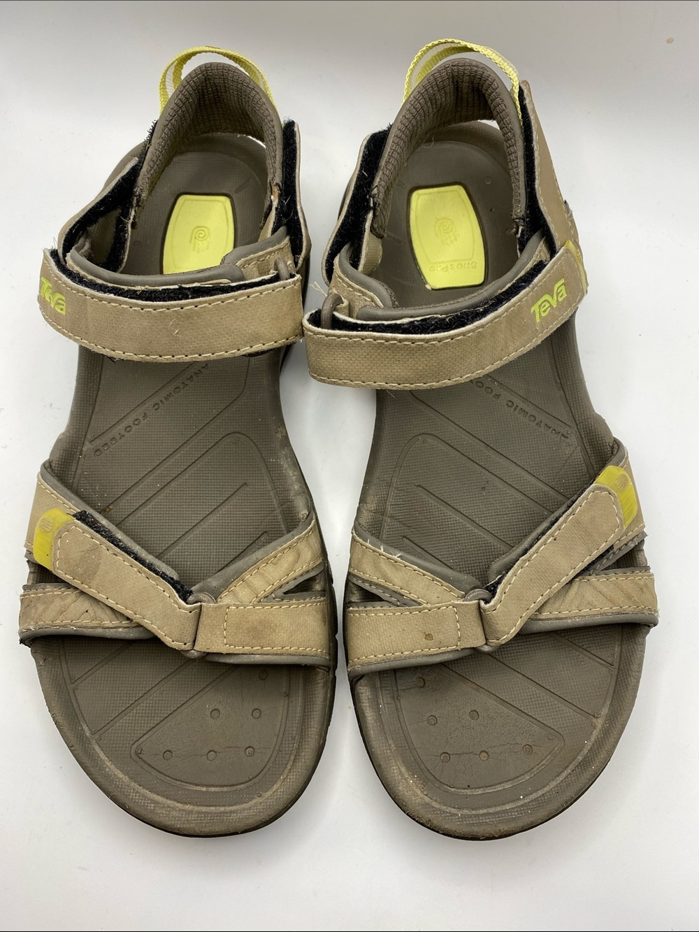 These are Teva Numa waterproof hiking sandals in a brown and lime green colorway